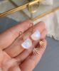 moonstone spike earrings in hand